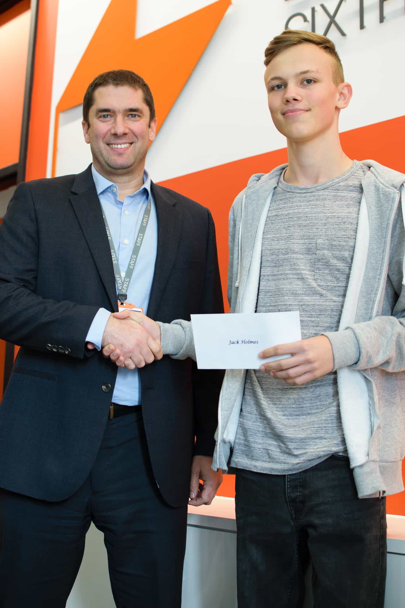 Student receiving scholarship cheque