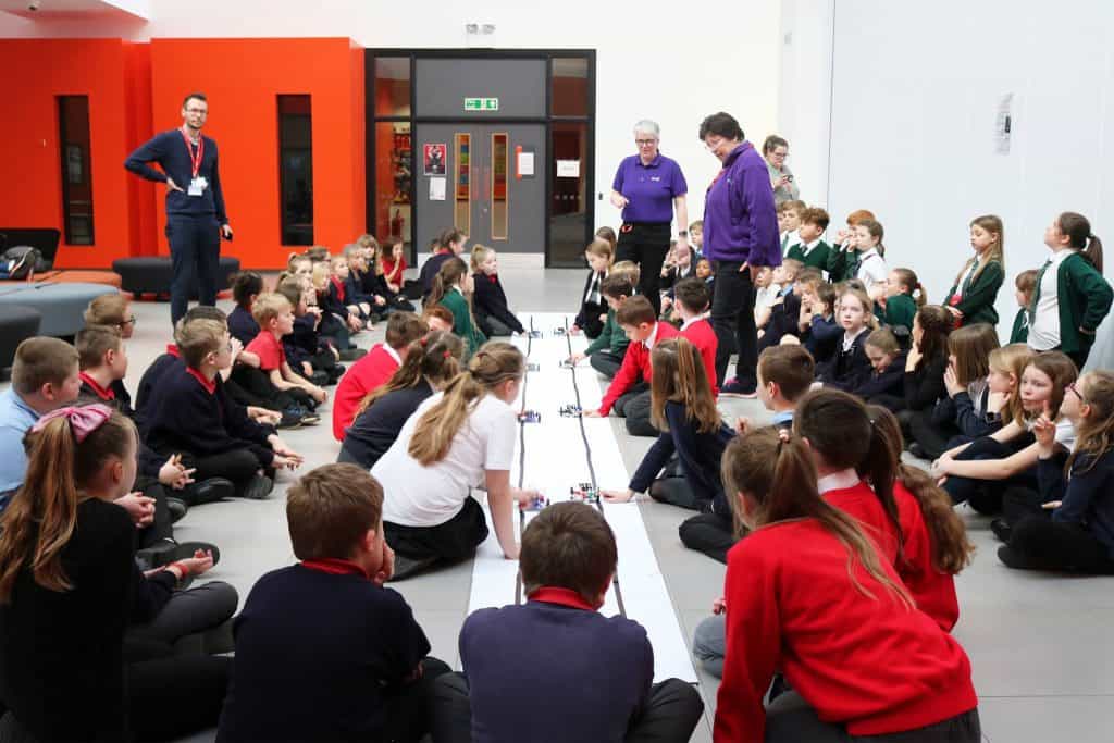 Large group of primary school students participating in an activity